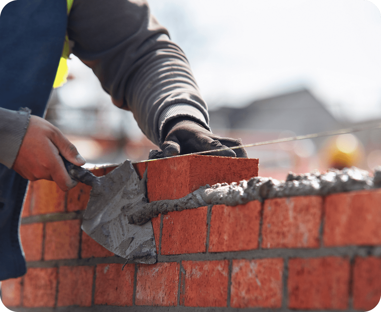 Construction worker laying bricks